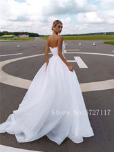 Load image into Gallery viewer, Strapless Ruched Bodice Ball Gowns 2080 Organza Wedding Dress with Detachable Long Sleeves Empire Bridal Gowns